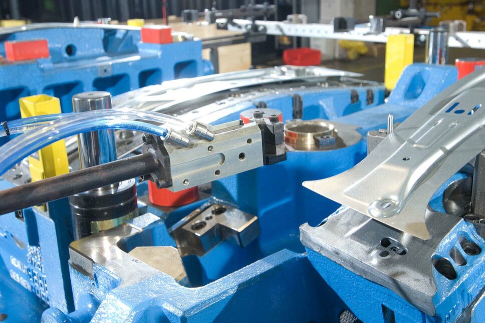 Close-up of a blue tool for cold forming B-pillars for vehicles designed and produced by weba Werkzeugbau, a expert in toolmaking solutions for cold stamping technology.